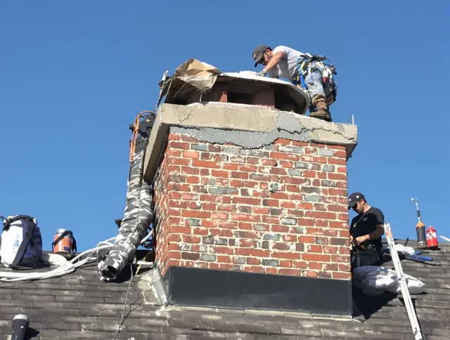 Fullerton Chimney Sweep installing a custom chimney crown in Fullerton, CA