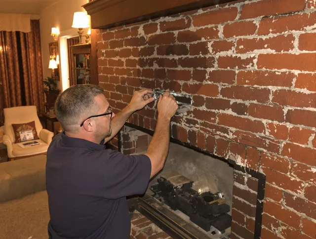 Fullerton Chimney Sweep expert fixing a fireplace in Fullerton, CA